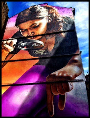 Glasgow street art - girl with a magnifying glass